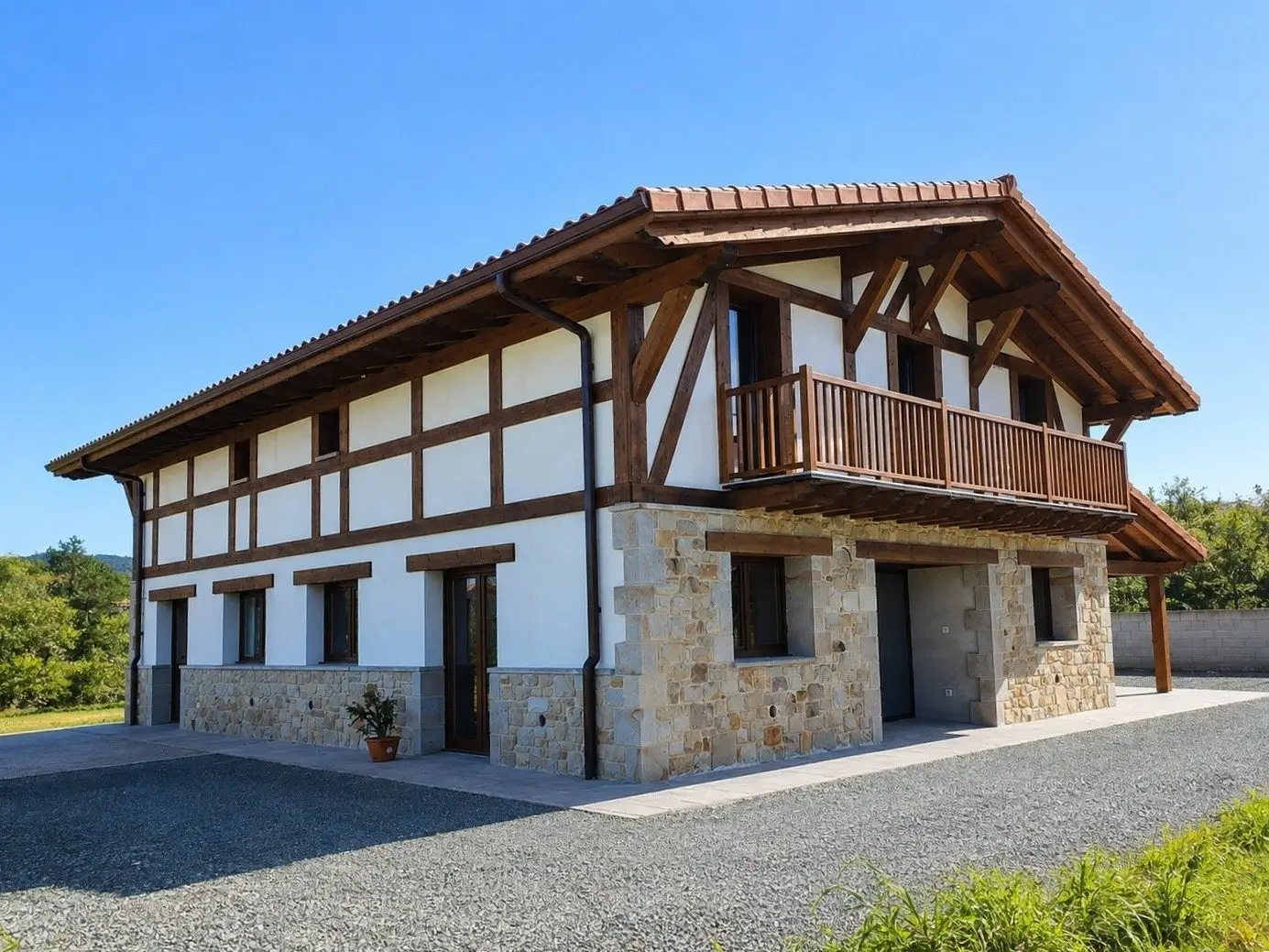 Caserío reconstruido en Basozabal con dos viviendas, piedra y entramado de madera